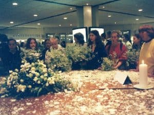Peace makers gather with flowers and peace messages at the opening of the convention