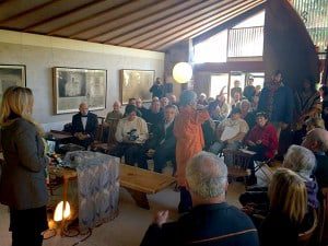 Mira Nakashima, center, welcomes the gathering