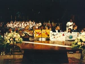 Children representing nations of the world carrying hand made Ribbons for Peace organized by The Ribbon International.