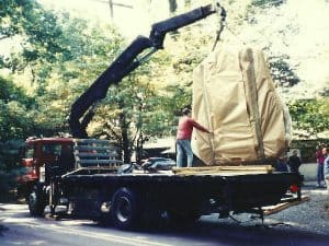 Loading the Sacred Peace Table by crane onto a flat bed truck outside the shop in New Hope, PA.