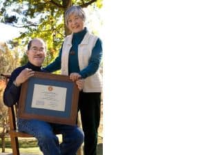 Kevin and Mira Nakashima holding the National Register of Historic Places Plaque, received in August 2008.