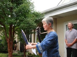 Mira Nakashima preparing to lead a Song for Peace, with Fred Veith in the background.