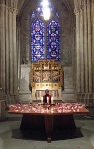 At the close of the ceremony, Mira at the Altar with candles and fragrant rose petals.
