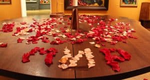 Using the fragrant rose petals that covered the table, the participants spelled out the word Mir, which means Peace in Russian.