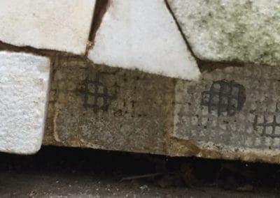 Ben Shahn mosaic damage. Changes in humidity and the porous nature of regular cement mortar has also contributed to fallen tiles.
