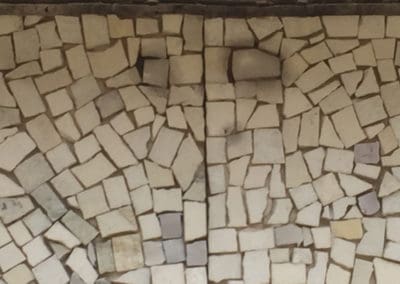 Ben Shahn mosaic damage. Acid contamination has stained tesserae re-attached with contaminated caulk.