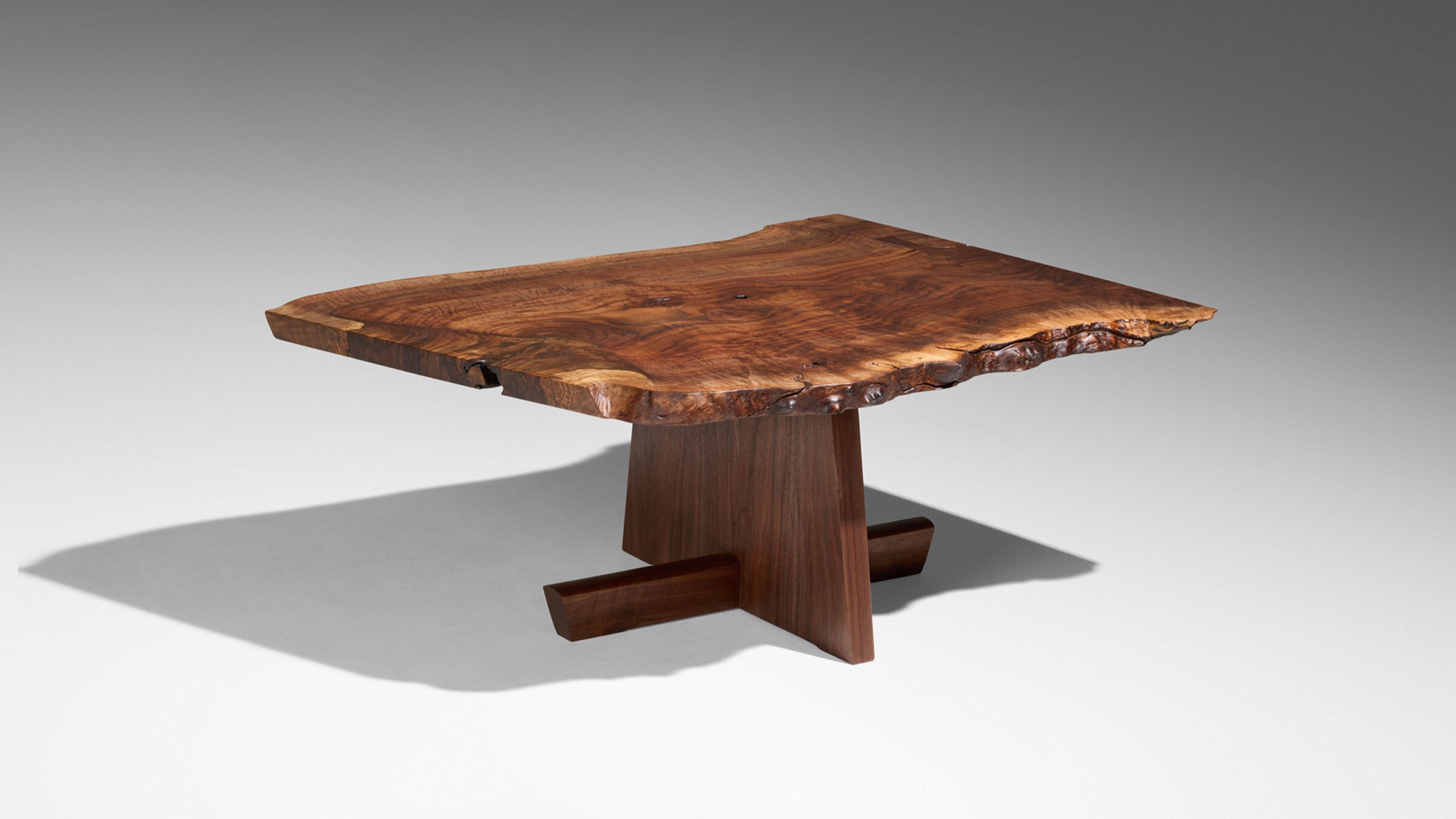 Free-edge coffee table made out of warm, American Black Walnut.